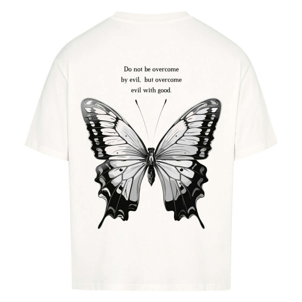 An oversized t-shirt featuring a delicate butterfly design with a motivational Bible verse printed on the back. The tshirt has a relaxed fit, soft fabric, and an inspiring, stylish design, perfect for comfort and sharing positivity.